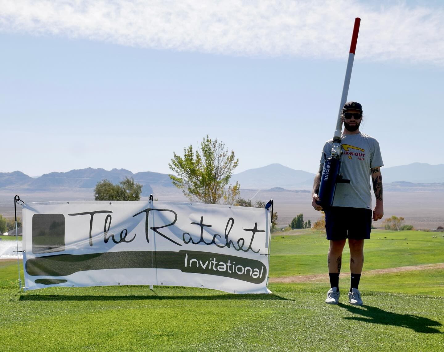The Ratchet Invitational banner on the desert course